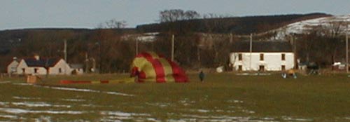 Gone --- The balloon is packed away under the supervision of it's pilot Robert Worsman