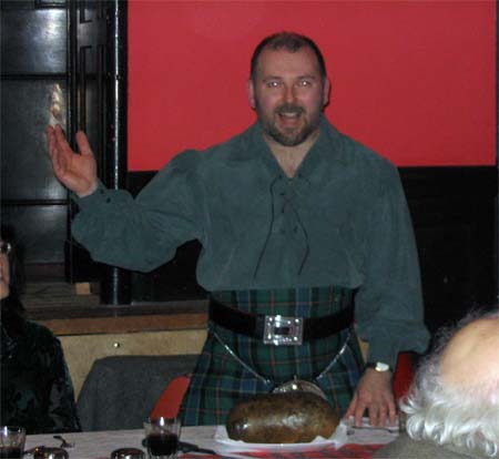 Robin Falconer toasts the Haggis